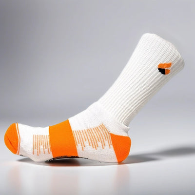 White and orange tennis sock with Active Arc metatarsus compression and seamless toe design for enhanced performance.